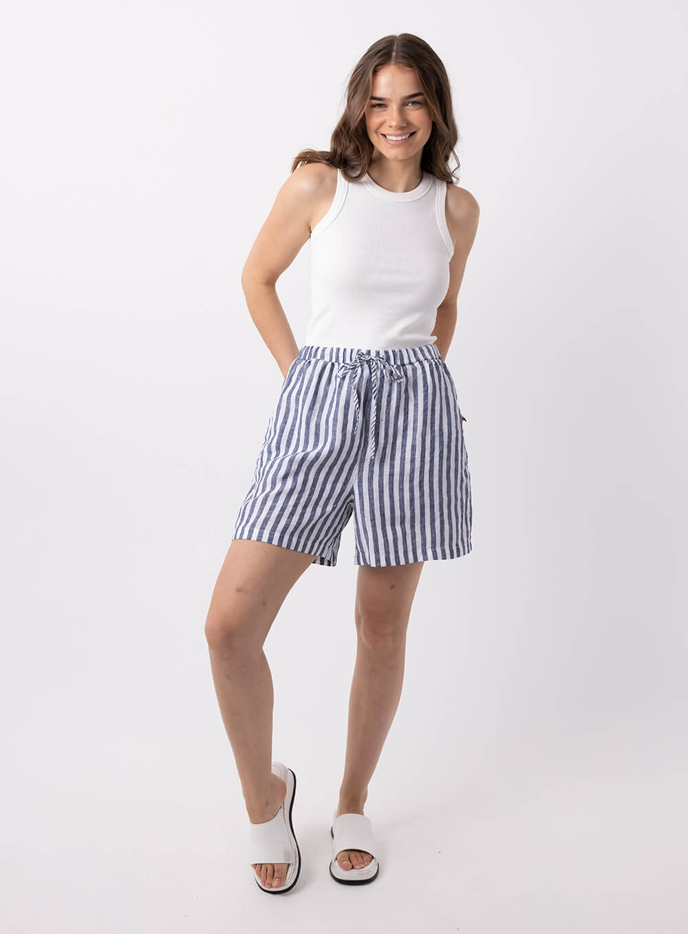 Abbi Stripe linen short in navy and white with elastic tie waist. Loose fit and mid thigh length