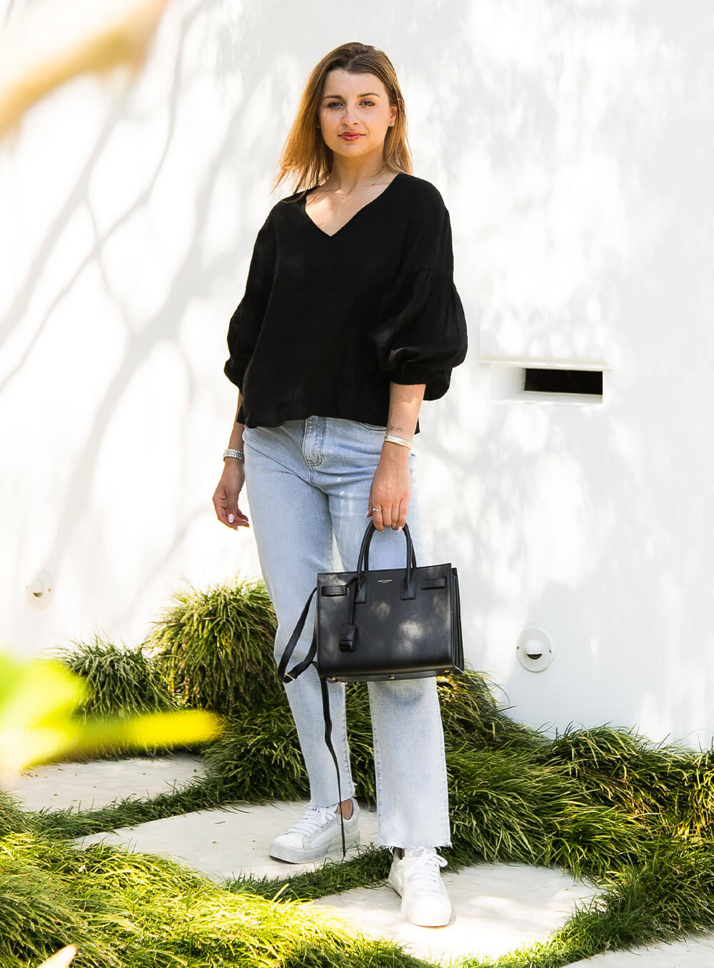 The Celeste Top in black has an elasticised cuff, ruched sleeve detail, v neck with collar detail and breathable with soft washed linen