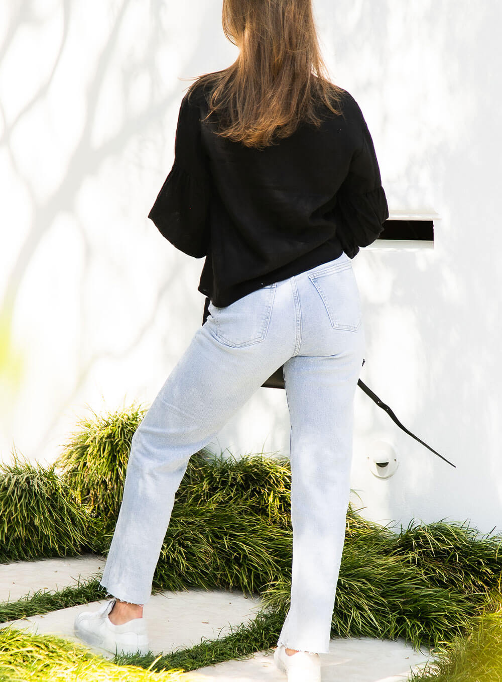The Celeste Top in black has an elasticised cuff, ruched sleeve detail, v neck with collar detail and breathable with soft washed linen