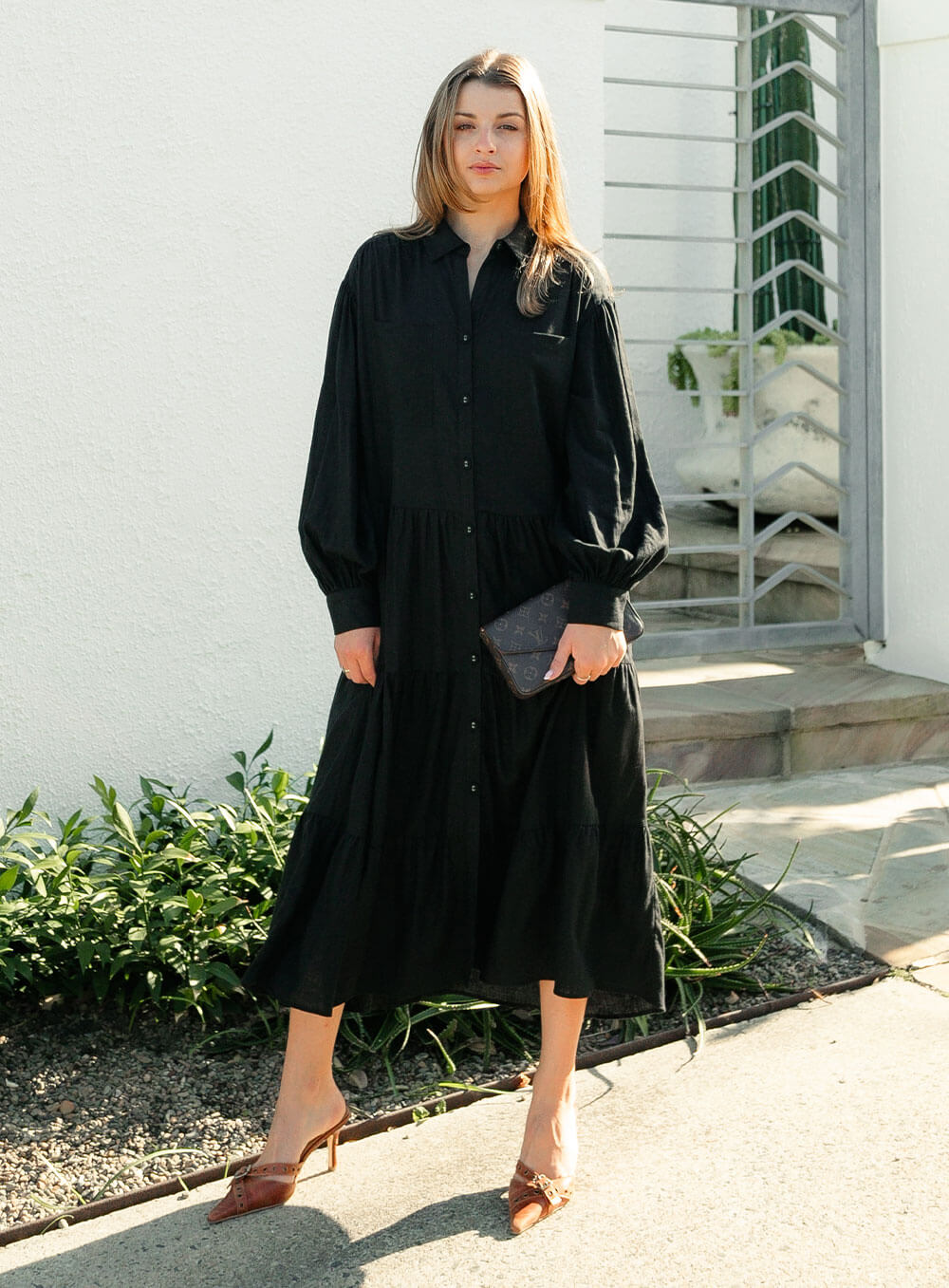 The Daisy Linen Midi Dress in black is made from 100% linen, It's overised layers drape over the body flowing effortlessly.