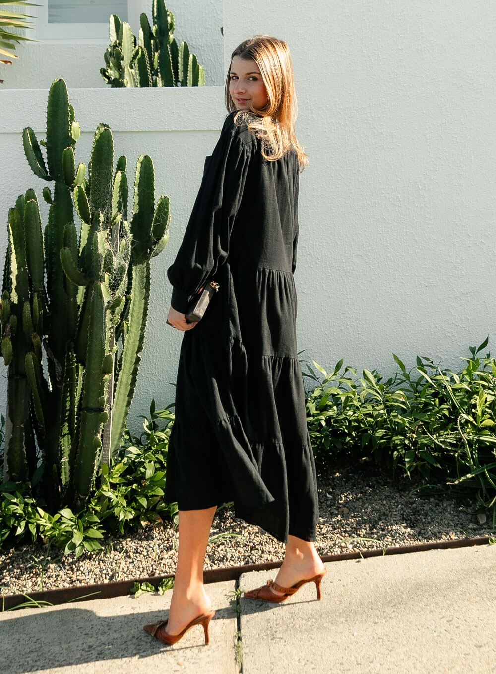 The Daisy Linen Midi Dress in black is made from 100% linen, It's overised layers drape over the body flowing effortlessly.