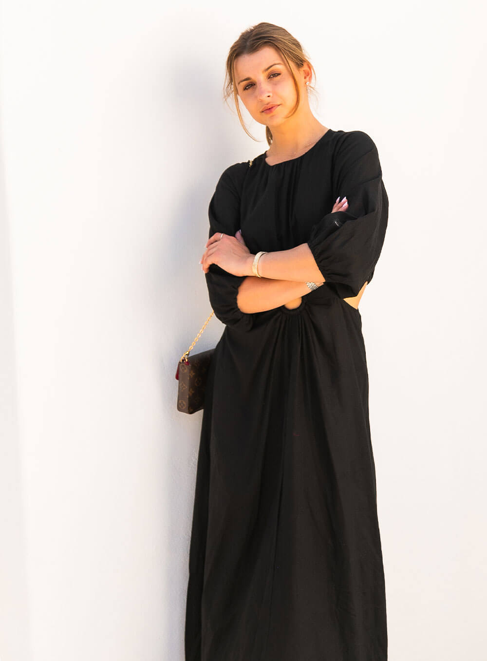 The Margot Linen mid length dress in black features an invisible zip in centre back, strategically placed side cut outs. Circle detail centre front.