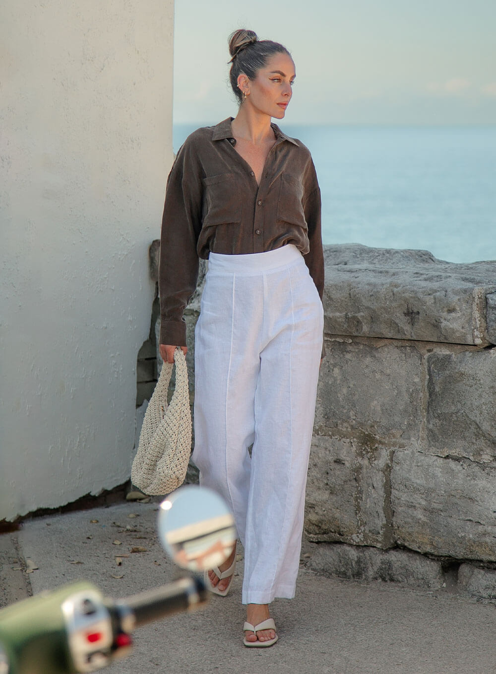 The Sienna Cupro shirt in chocolate is a long sleeve soft velvet feeling long sleeve shirt with 2 chest pockets, scoop hem and self fabric buttons down the front.