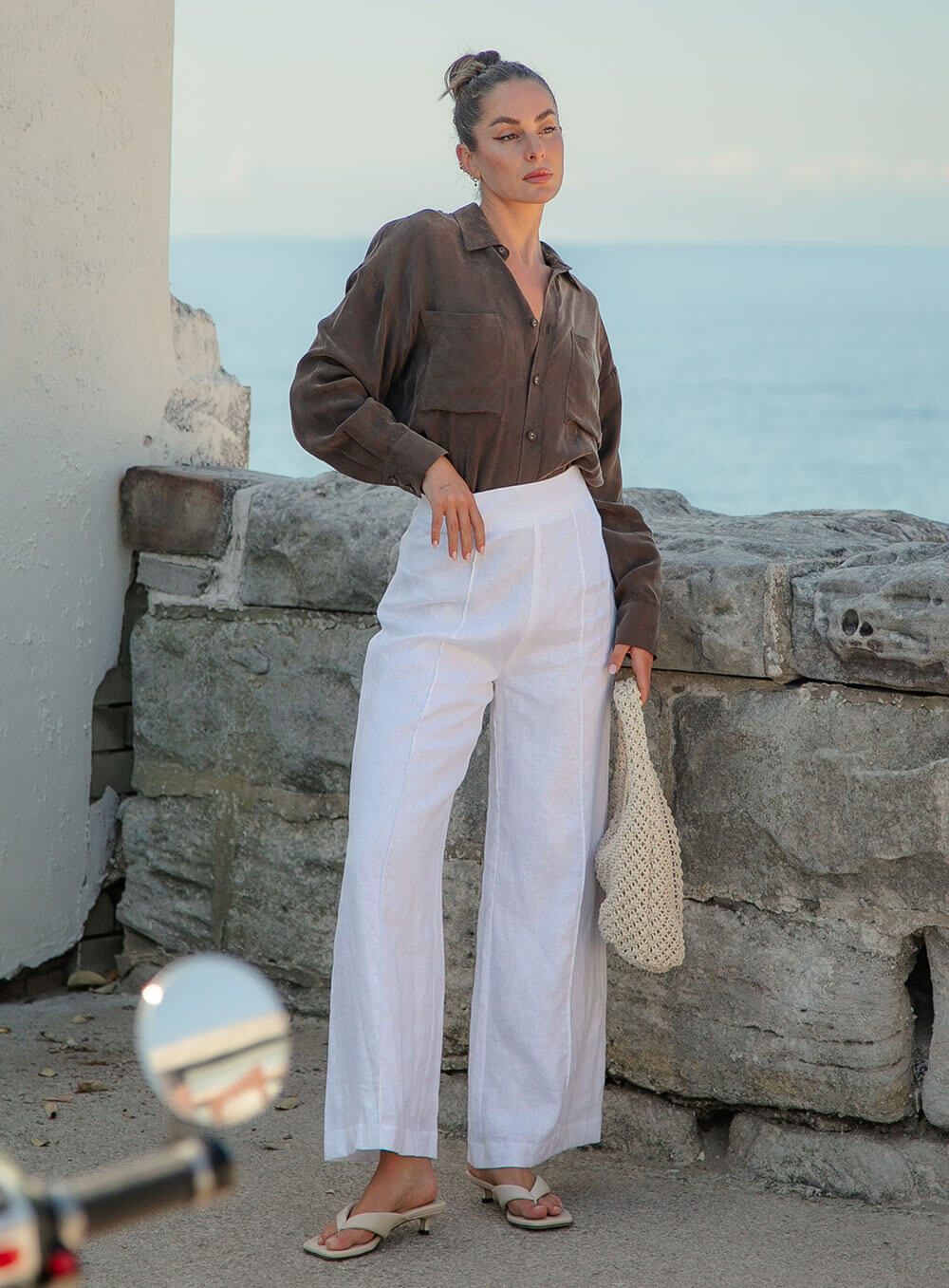 The Sienna Cupro shirt in chocolate is a long sleeve soft velvet feeling long sleeve shirt with 2 chest pockets, scoop hem and self fabric buttons down the front.