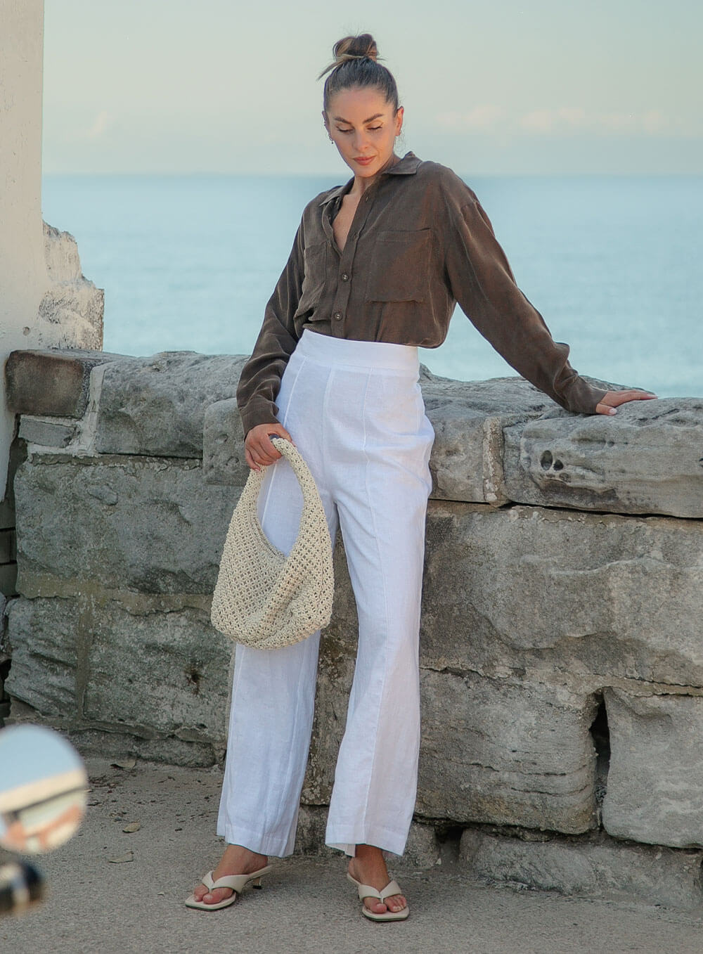The Sienna Cupro shirt in chocolate is a long sleeve soft velvet feeling long sleeve shirt with 2 chest pockets, scoop hem and self fabric buttons down the front.