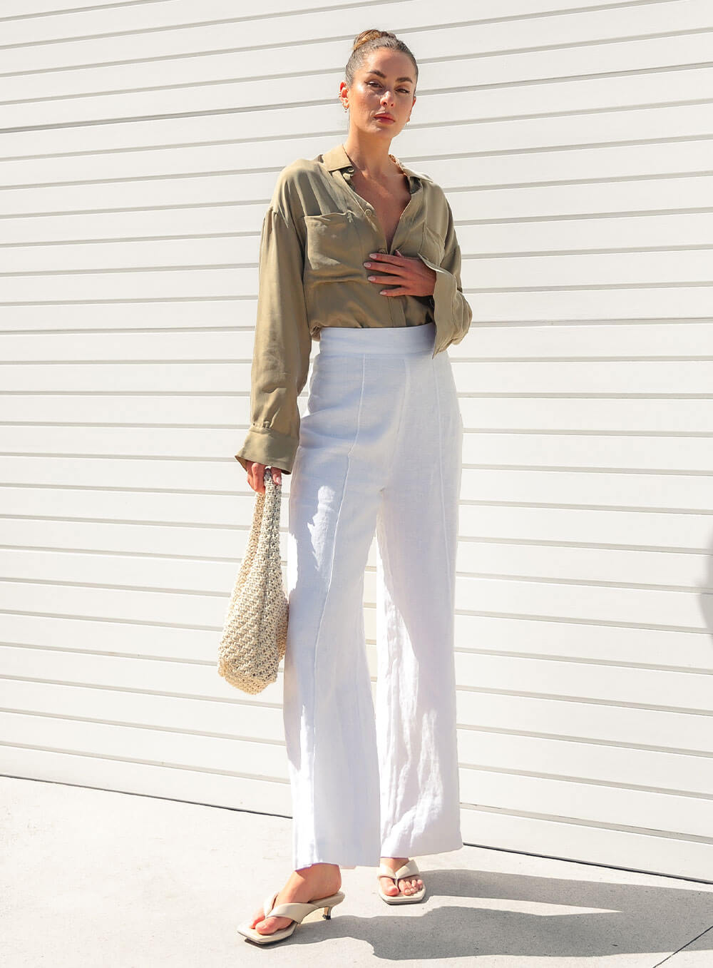 The Sienna Cupro shirt in latte is a long sleeve soft velvet feeling long sleeve shirt with 2 chest pockets, scoop hem and self fabric buttons down the front.