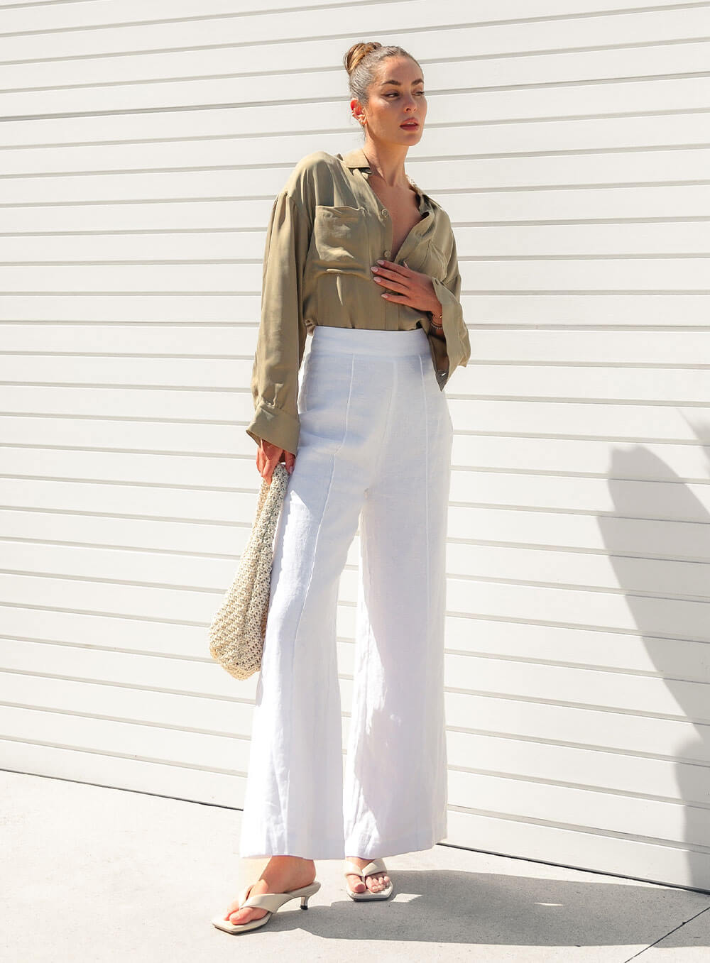 The Sienna Cupro shirt in latte is a long sleeve soft velvet feeling long sleeve shirt with 2 chest pockets, scoop hem and self fabric buttons down the front.