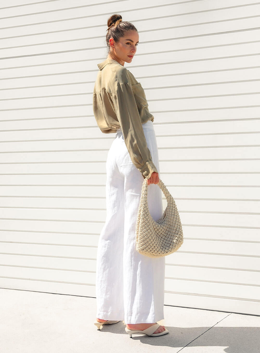 The Sienna Cupro shirt in latte is a long sleeve soft velvet feeling long sleeve shirt with 2 chest pockets, scoop hem and self fabric buttons down the front.