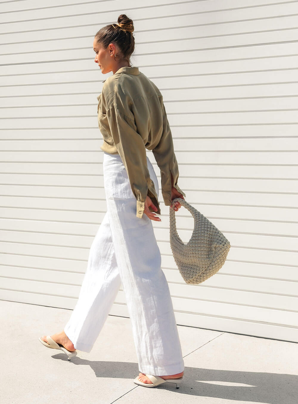 The Sienna Cupro shirt in latte is a long sleeve soft velvet feeling long sleeve shirt with 2 chest pockets, scoop hem and self fabric buttons down the front.
