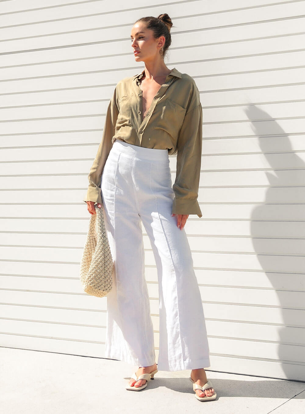The Sienna Cupro shirt in latte is a long sleeve soft velvet feeling long sleeve shirt with 2 chest pockets, scoop hem and self fabric buttons down the front.