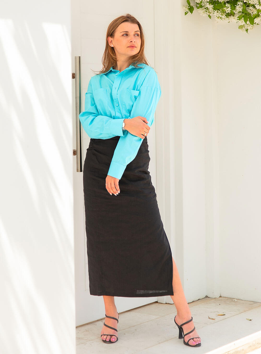 The Sienna Poplin Shirt in skye blue features button through front, scooped shirt hem style, self fabric covered buttons, luxe soft and breathable cotton poplin base