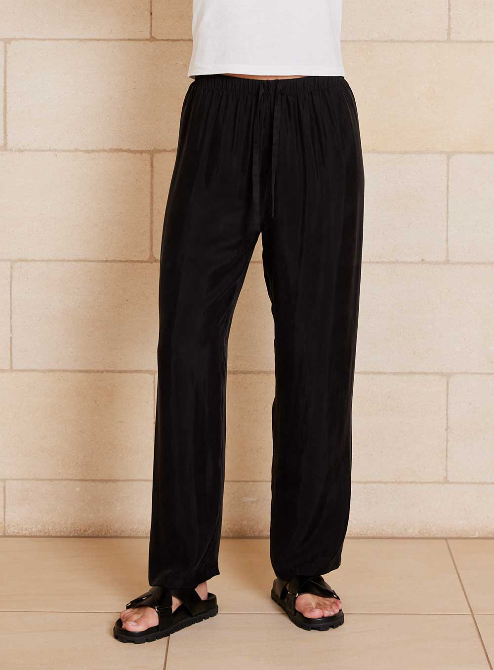 The Chloe Cupro pant features cupro and viscose blended fabrication with a velvety soft handfeel that creates a draping look, a drawcord waistband, straight leg design with side pockets.