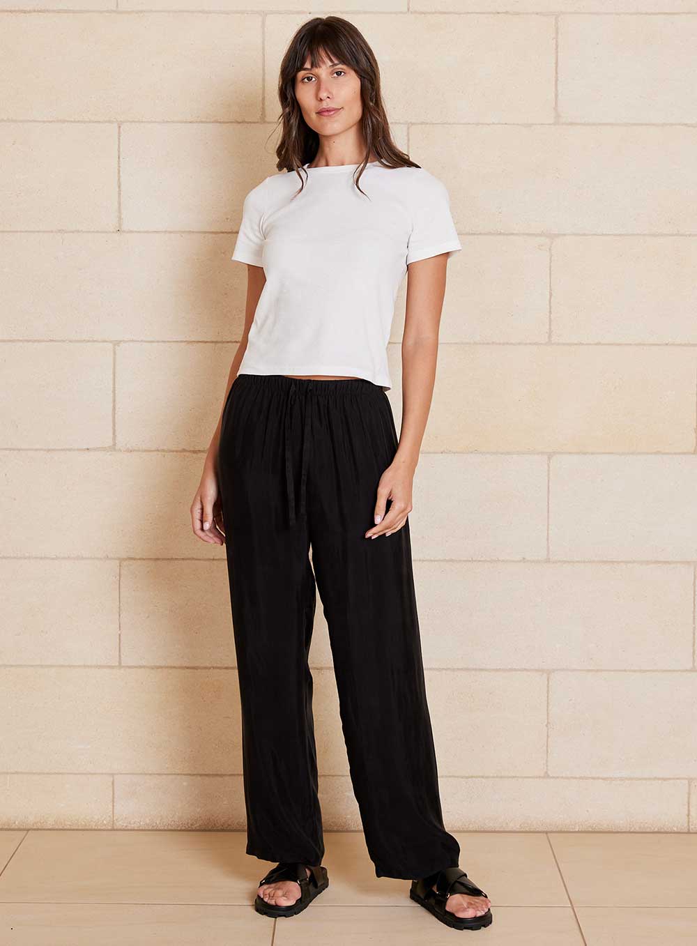 The Chloe Cupro pant features cupro and viscose blended fabrication with a velvety soft handfeel that creates a draping look, a drawcord waistband, straight leg design with side pockets.