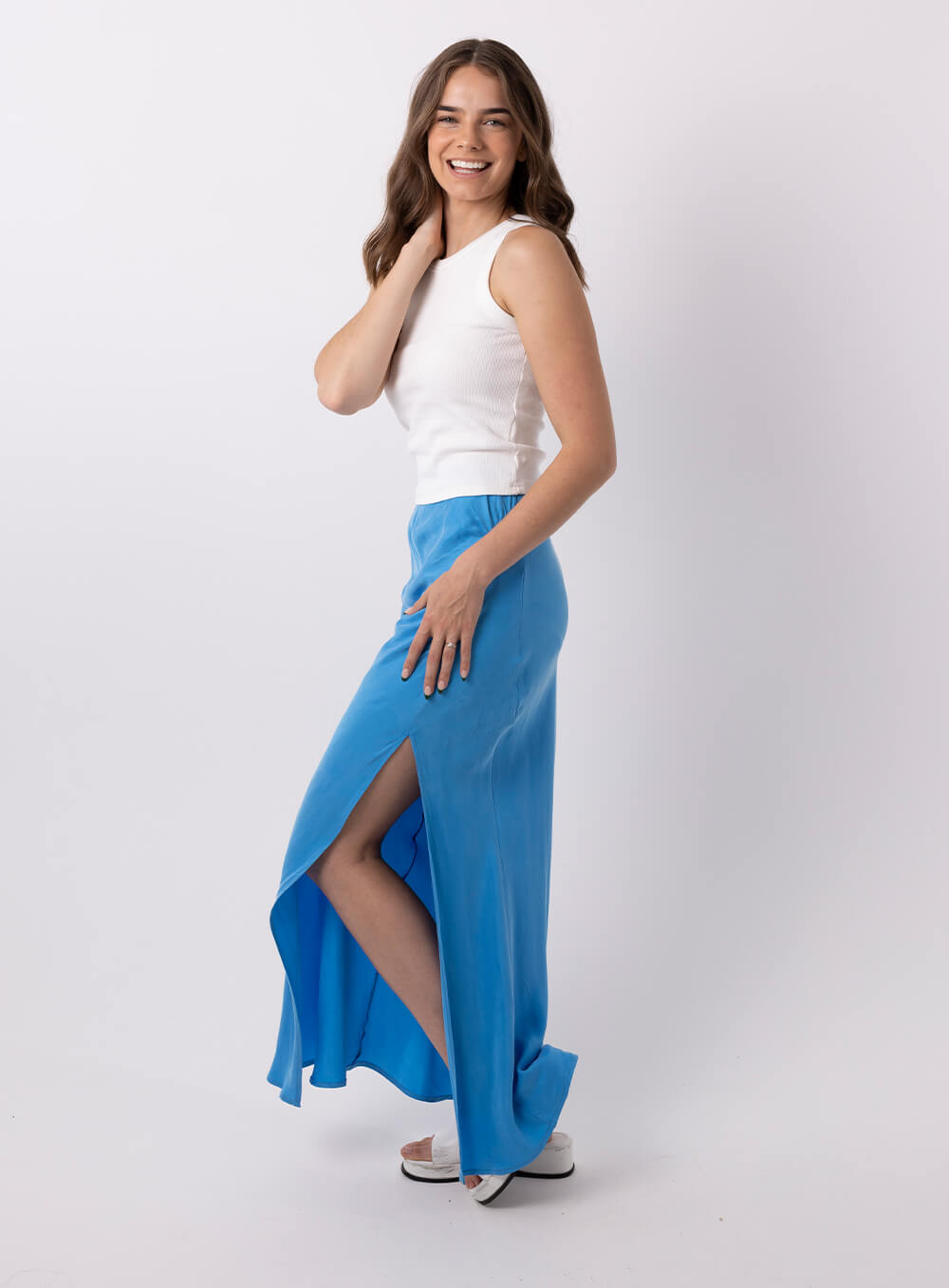 The Allira Cupro skirt is made from a soft feel cupro fabric and features a side split, side rouched panel to create a draping effect through the hip and is a full length skirt