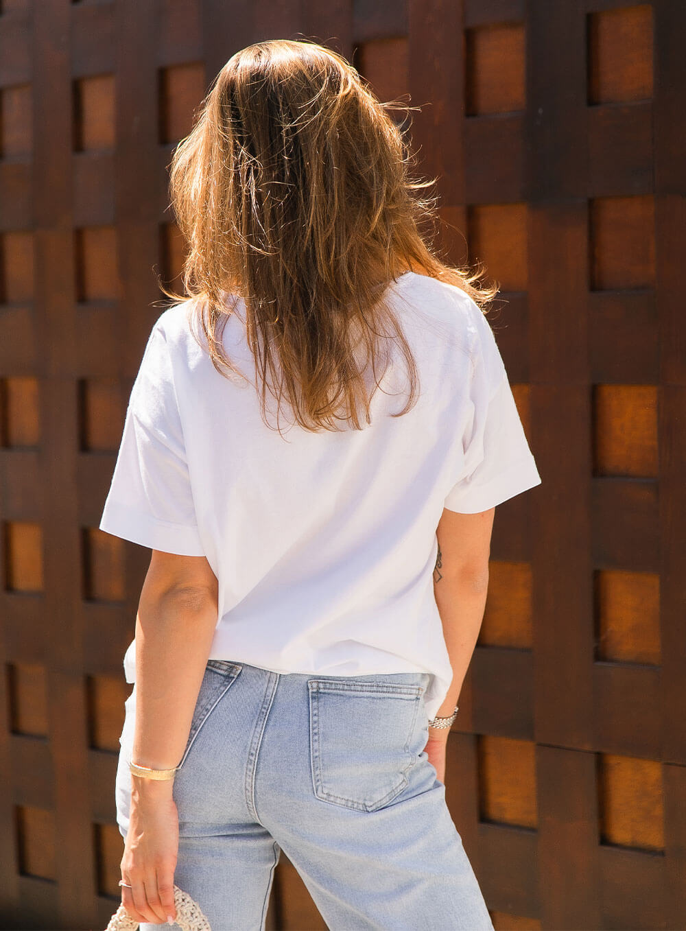 The Celeste Organic Cotton white t-shirt is designed to be loose fit through teh body, slightly cropped in length, loose crew neck line with self fabric neck trim.