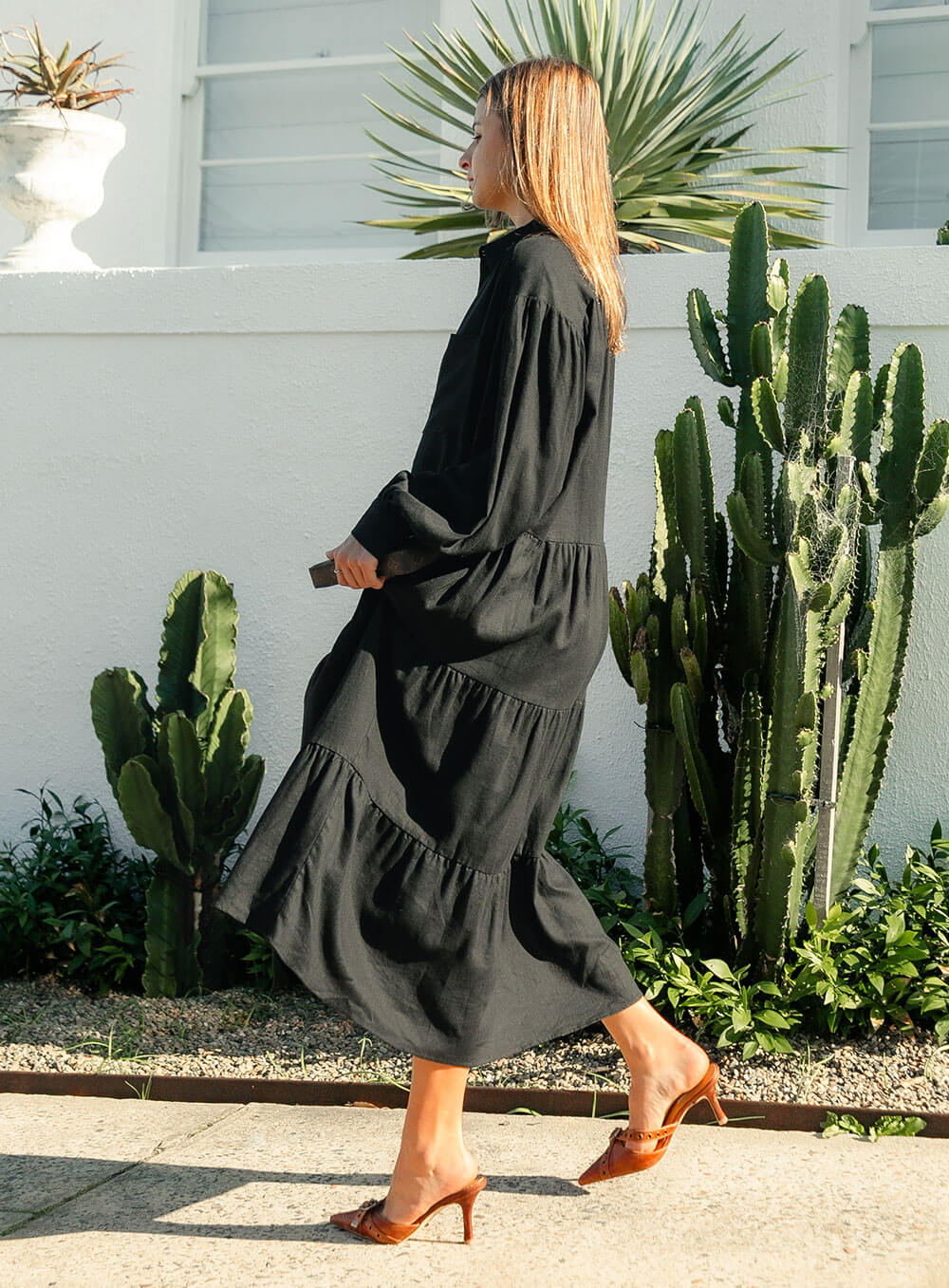 The Daisy Linen Midi Dress in black is made from 100% linen, It's overised layers drape over the body flowing effortlessly.
