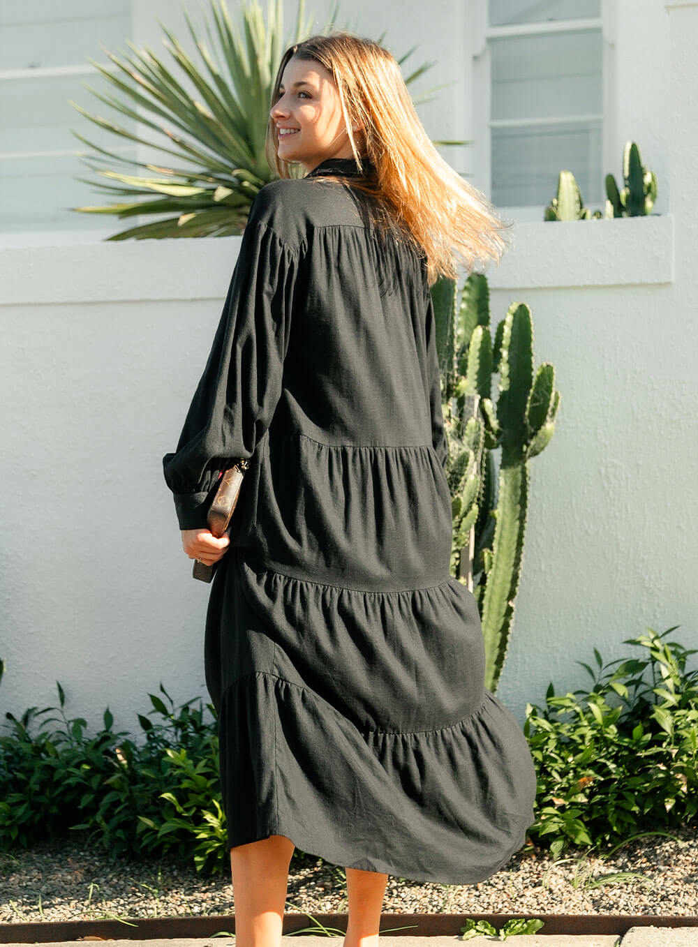 The Daisy Linen Midi Dress in black is made from 100% linen, It's overised layers drape over the body flowing effortlessly.