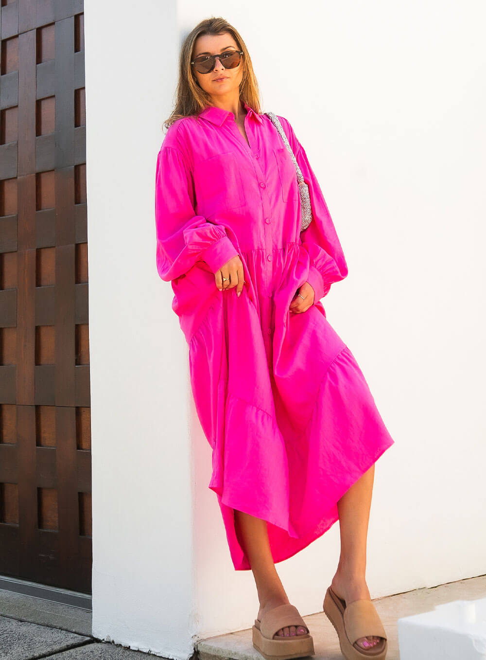 The Daisy Linen Midi Dress in pink is made from 100% linen, It's overised layers drape over the body flowing effortlessly.