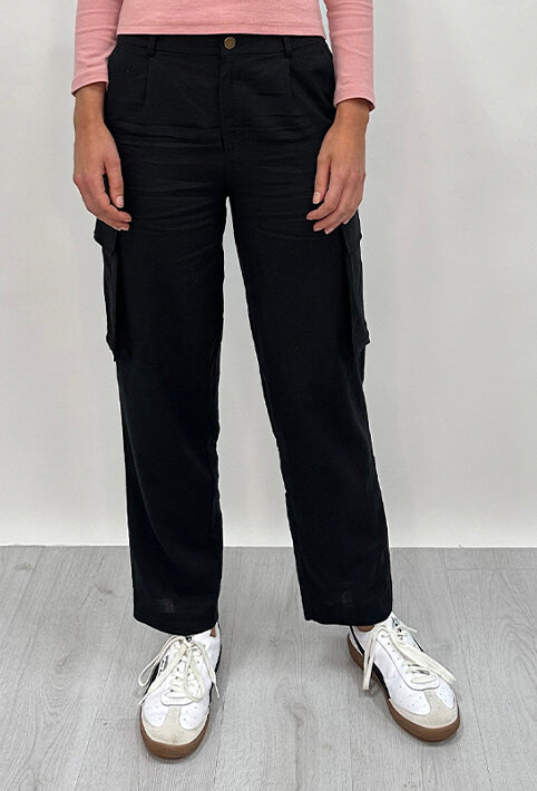 Athena Linen Cargo Pant in black is 100% Linen, elastic waistband at back, belt loops, slightly tapered towards the hem, 2 Pockets at back, 2 Pockets on side leg