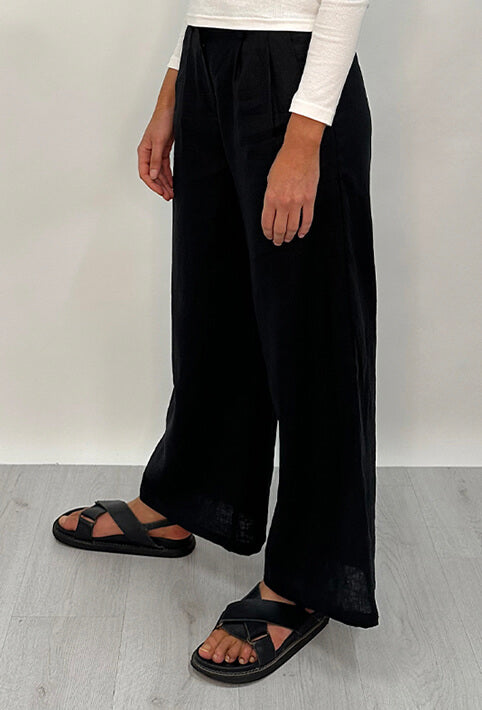 Edith Linen Culottes in black is 100% Linen with elastic waistband at back, only slightly cropped,  button and zip enclosure at front and 2 side pockets