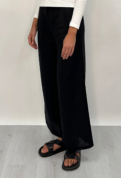 Edith Linen Culottes in black is 100% Linen with elastic waistband at back, only slightly cropped,  button and zip enclosure at front and 2 side pockets