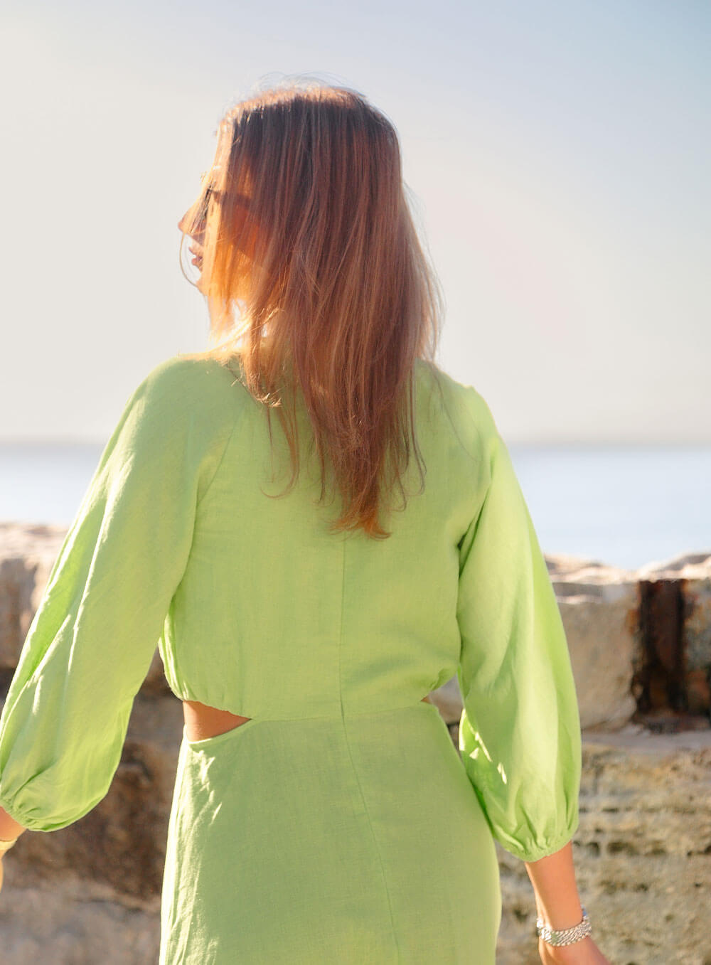 The Margot Linen mid length dress in lime features an invisible zip in centre back, strategically placed side cut outs. Circle detail centre front.