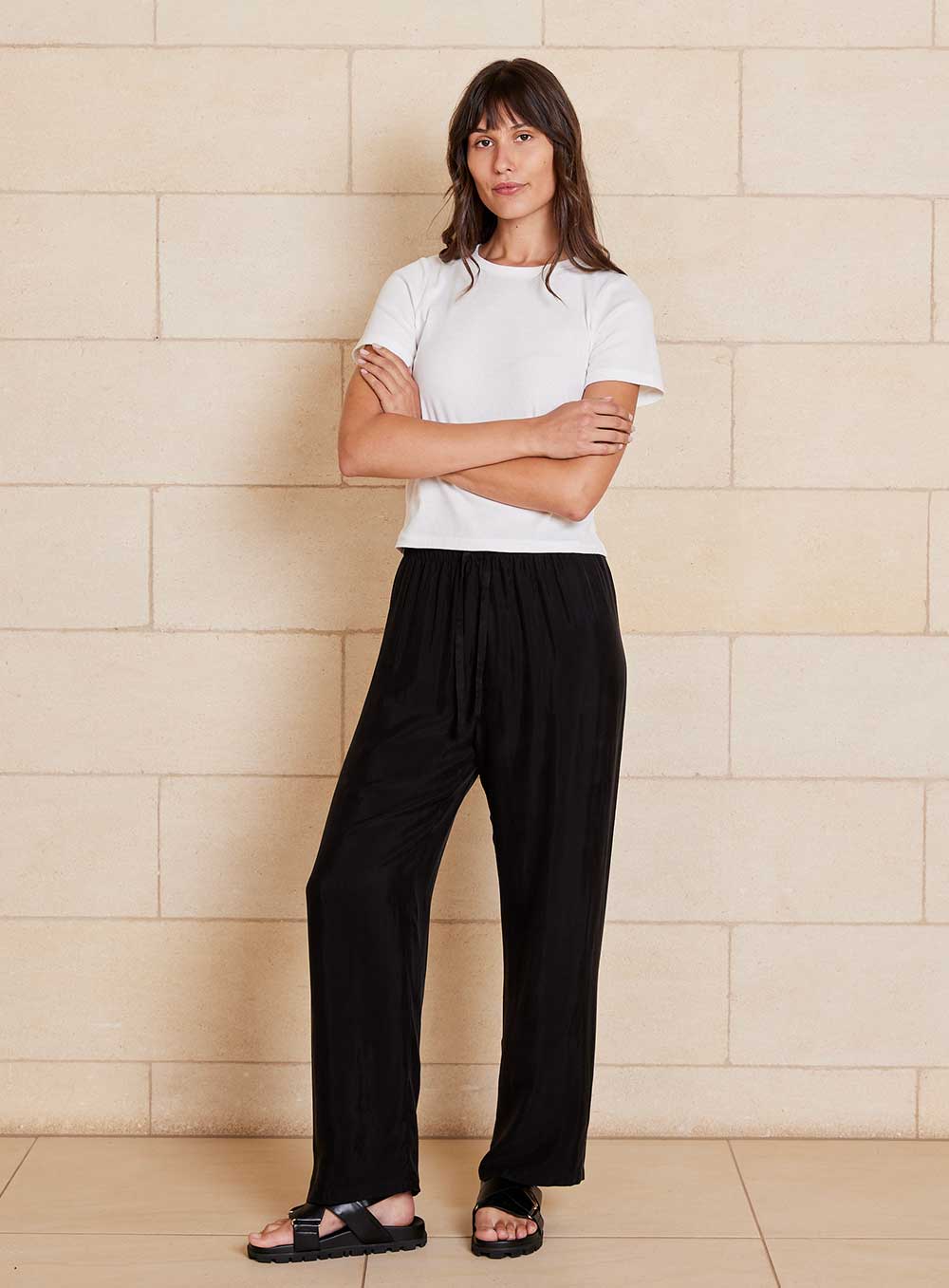 The Chloe Cupro pant features cupro and viscose blended fabrication with a velvety soft handfeel that creates a draping look, a drawcord waistband, straight leg design with side pockets.