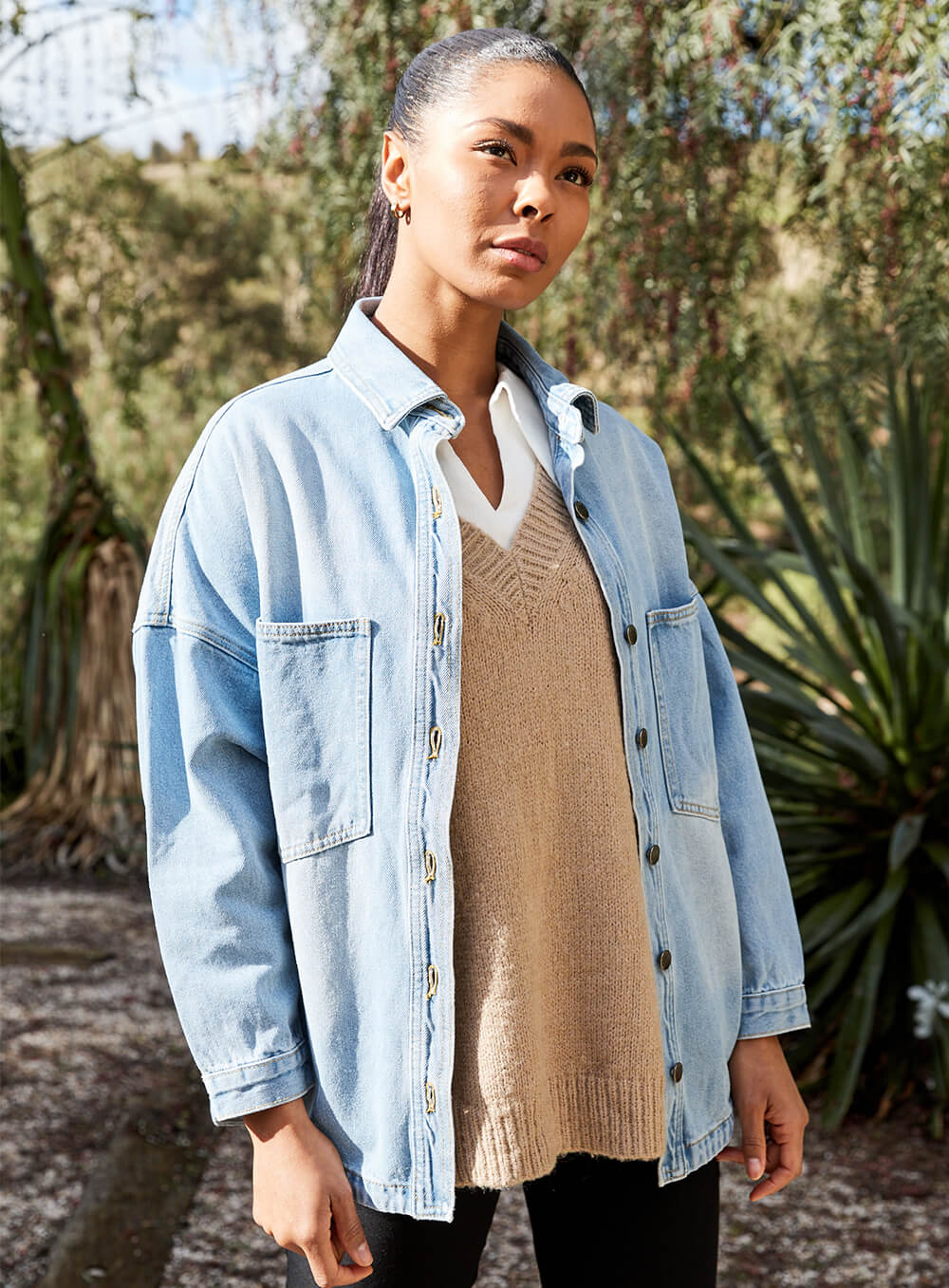 The Wake Up Denim Jacket in blue features full button through front, collar at the neck line, 2 large chest pockets, 2 side pockets, functional button down cuff adn scoop hem.